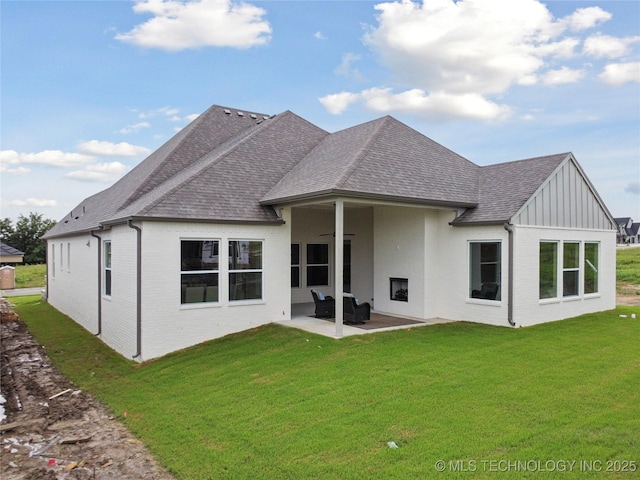 2607 E 135th Dr S, Bixby, OK 74008 - rear view of house with a shingled roof, a patio area, a yard, and brick siding