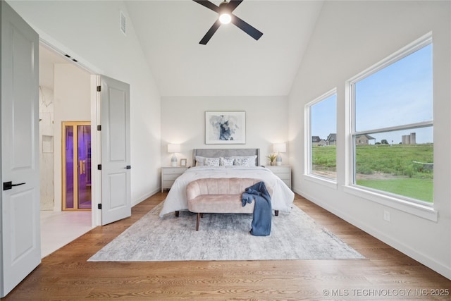 2607 E 135th Dr S, Bixby, OK 74008 - bedroom featuring wood finished floors, a ceiling fan, and high vaulted ceiling