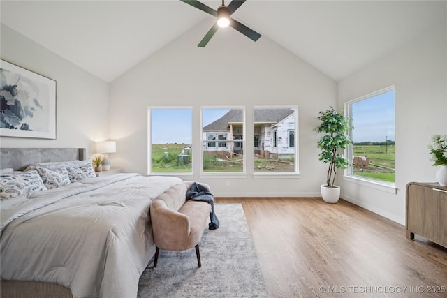 2607 E 135th Dr S, Bixby, OK 74008 - bedroom with wood finished floors, lofted ceiling, and ceiling fan