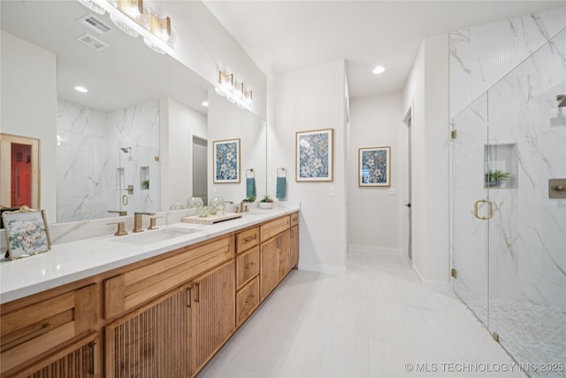 2607 E 135th Dr S, Bixby, OK 74008 - full bath with double vanity, a marble finish shower, and recessed lighting