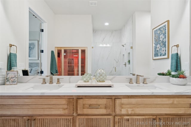 2607 E 135th Dr S, Bixby, OK 74008 - bathroom with double vanity, a marble finish shower, and ensuite bathroom