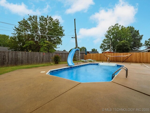 540 S Hamilton Ave, Dewey, OK 74029 - view of pool featuring a water slide, a patio area, and a fenced backyard