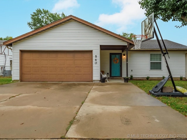 540 S Hamilton Ave, Dewey, OK 74029 - view of front of property with a garage and concrete driveway