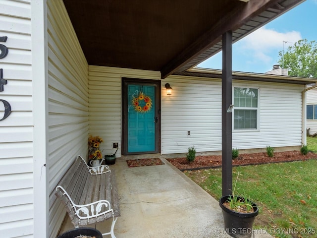 540 S Hamilton Ave, Dewey, OK 74029 - view of exterior entry featuring a chimney