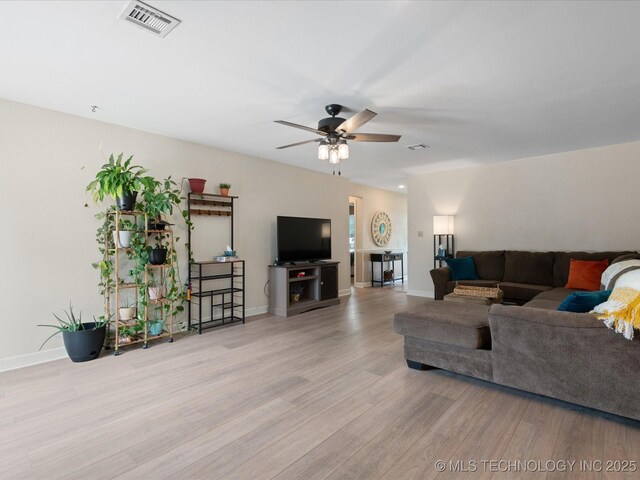 540 S Hamilton Ave, Dewey, OK 74029 - living room featuring wood finished floors, a ceiling fan, and baseboards