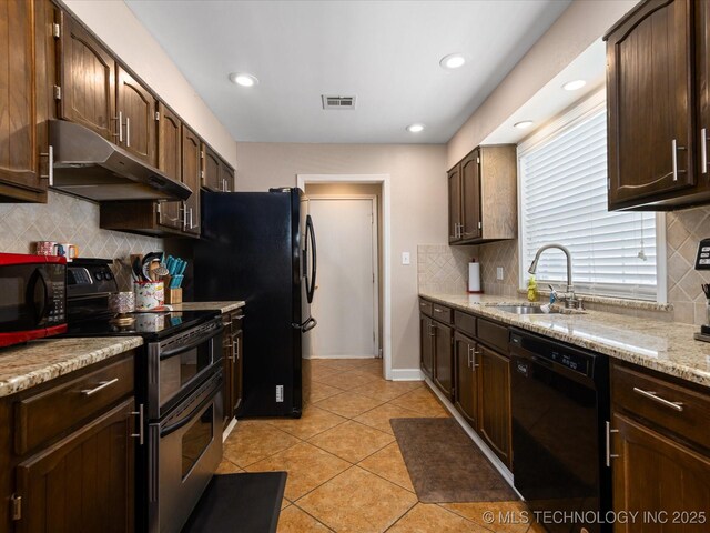 540 S Hamilton Ave, Dewey, OK 74029 - kitchen with under cabinet range hood, black appliances, a sink, tasteful backsplash, and dark brown cabinets