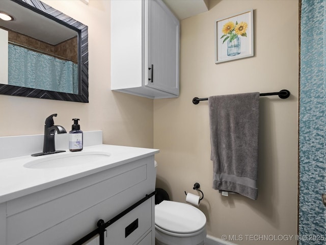 540 S Hamilton Ave, Dewey, OK 74029 - bathroom featuring vanity, toilet, and curtained shower