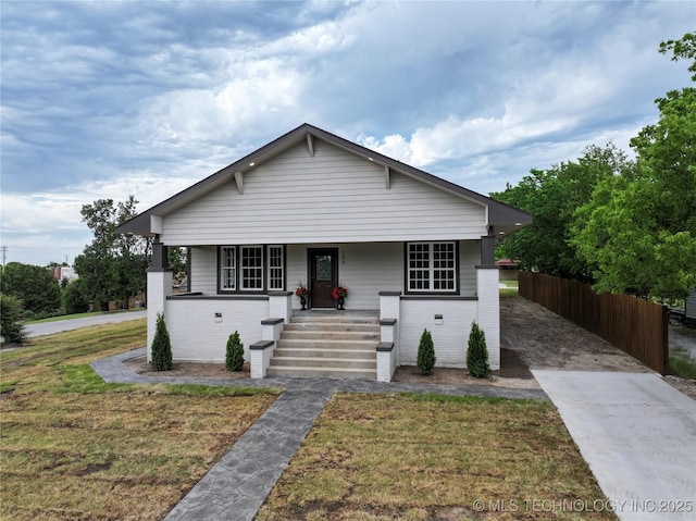 100 E Broadway, Sulphur, OK 73086 - bungalow-style home with covered porch and brick siding
