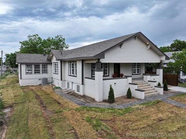 100 E Broadway, Sulphur, OK 73086 - view of front of property featuring a shingled roof, a porch, and cooling unit