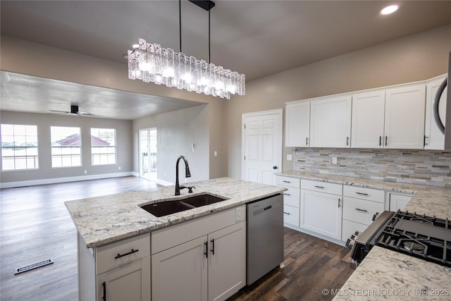 100 E Broadway, Sulphur, OK 73086 - kitchen featuring a sink, stainless steel dishwasher, gas stove, tasteful backsplash, and dark wood-style flooring
