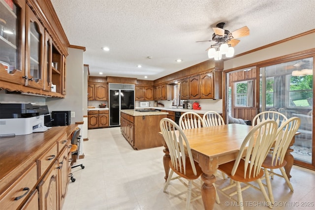 2956 E 69th St, Tulsa, OK 74136 - dining room with a textured ceiling, ceiling fan, crown molding, and recessed lighting