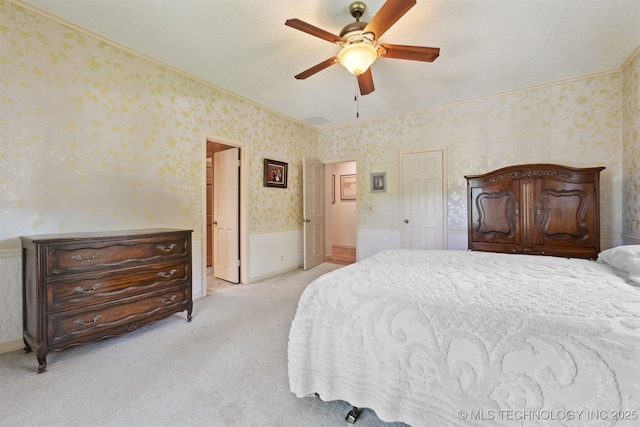 2956 E 69th St, Tulsa, OK 74136 - bedroom featuring wallpapered walls, light carpet, a ceiling fan, ornamental molding, and ensuite bathroom