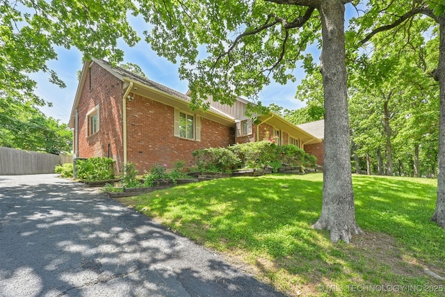 2956 E 69th St, Tulsa, OK 74136 - view of home's exterior featuring brick siding