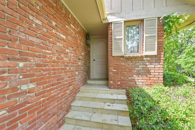 2956 E 69th St, Tulsa, OK 74136 - doorway to property featuring brick siding