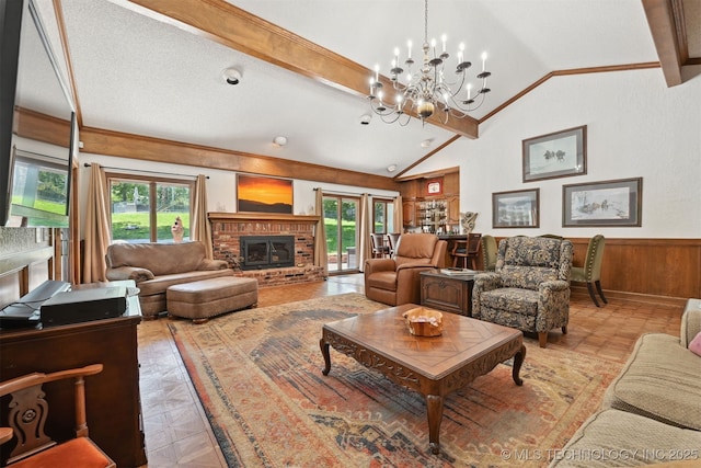 2956 E 69th St, Tulsa, OK 74136 - living room with healthy amount of natural light, vaulted ceiling, a chandelier, a wainscoted wall, and wooden walls