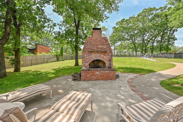 2956 E 69th St, Tulsa, OK 74136 - view of patio / terrace featuring an outdoor brick fireplace