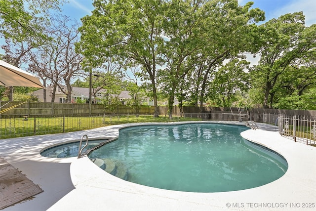 2956 E 69th St, Tulsa, OK 74136 - view of swimming pool with a patio area and a pool with connected hot tub