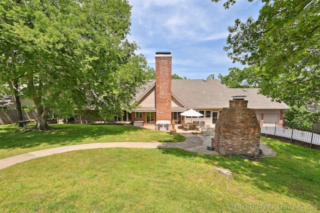2956 E 69th St, Tulsa, OK 74136 - view of yard featuring a patio and an attached garage