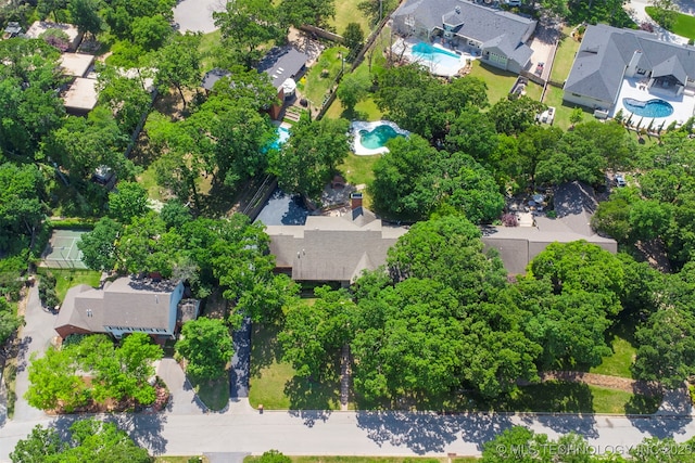 2956 E 69th St, Tulsa, OK 74136 - aerial overview of property's location with a pool area and nearby suburban area