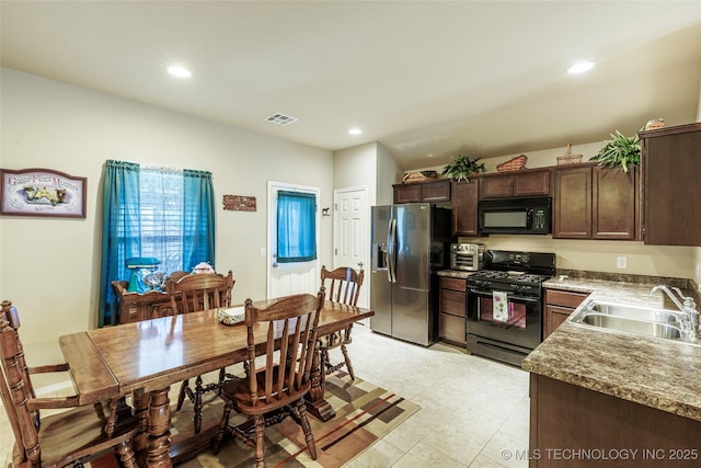 23218 Bessie Blvd, Claremore, OK 74019 - kitchen with black appliances, a sink, dark brown cabinetry, and recessed lighting