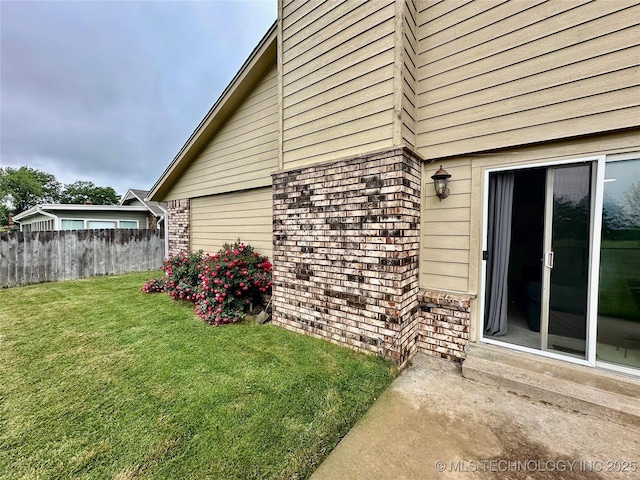 view of home's exterior featuring brick siding