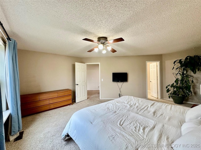 bedroom featuring carpet flooring, a ceiling fan, baseboards, and a textured ceiling