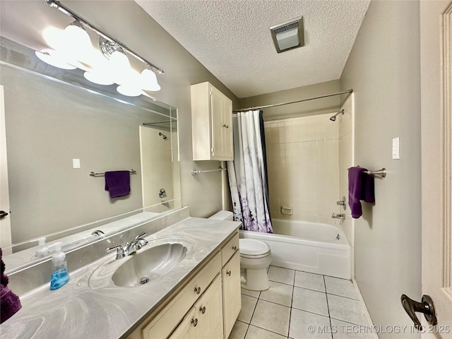 full bath featuring tile patterned flooring, toilet, shower / bathtub combination with curtain, vanity, and a textured ceiling