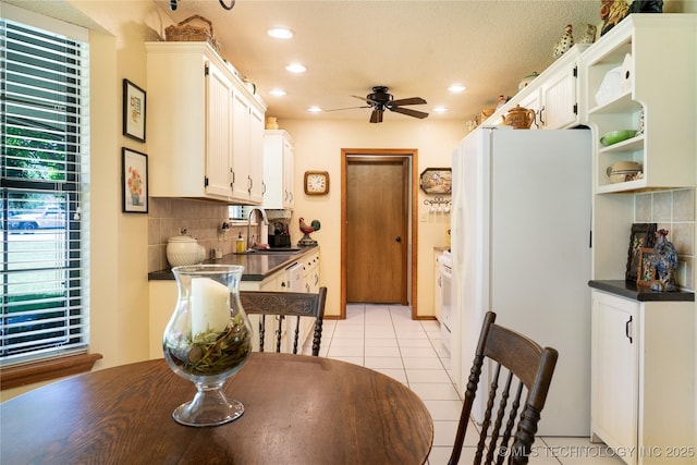 15919 E 79th St N, Owasso, OK 74055 - dining area with ceiling fan, light tile patterned floors, and recessed lighting