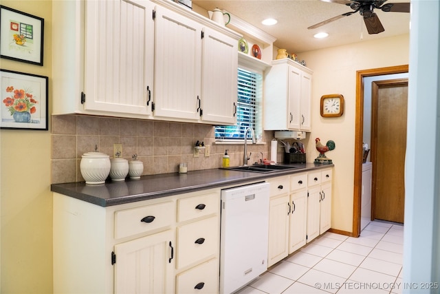 15919 E 79th St N, Owasso, OK 74055 - kitchen featuring dishwasher, a sink, dark countertops, backsplash, and recessed lighting