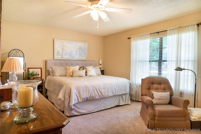 15919 E 79th St N, Owasso, OK 74055 - bedroom with carpet flooring, a textured ceiling, and a ceiling fan