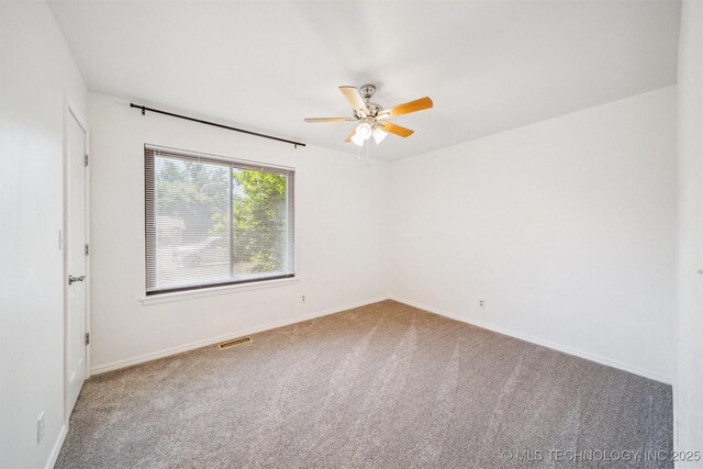 1010 S Wewoka Ave, Claremore, OK 74017 - carpeted empty room with a ceiling fan and baseboards