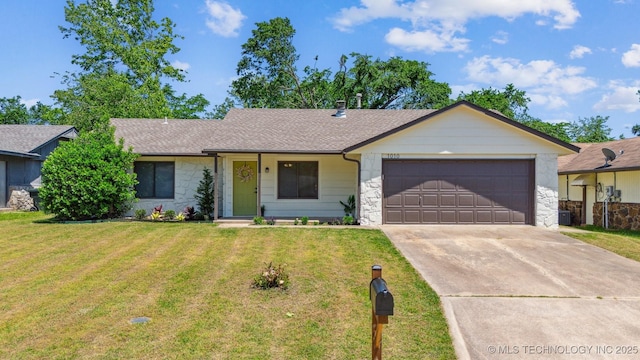 1010 S Wewoka Ave, Claremore, OK 74017 - ranch-style home with stone siding, a garage, concrete driveway, and a front lawn