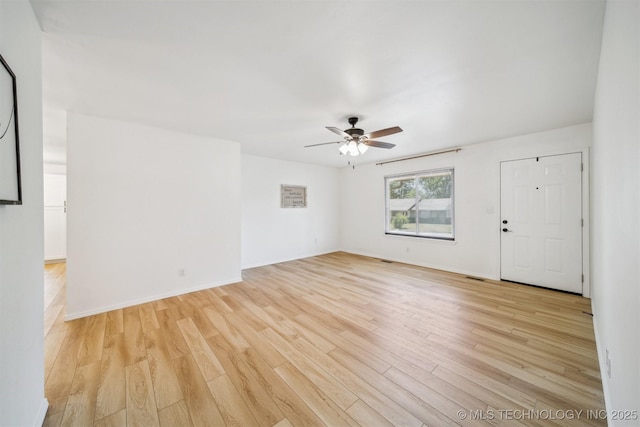 1010 S Wewoka Ave, Claremore, OK 74017 - spare room with ceiling fan, light wood-style flooring, and baseboards