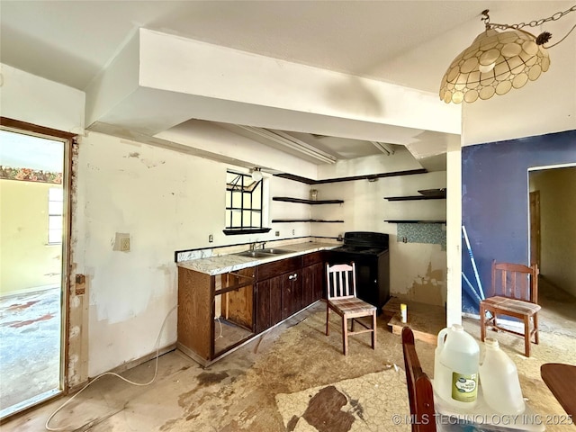 kitchen featuring electric range and a sink