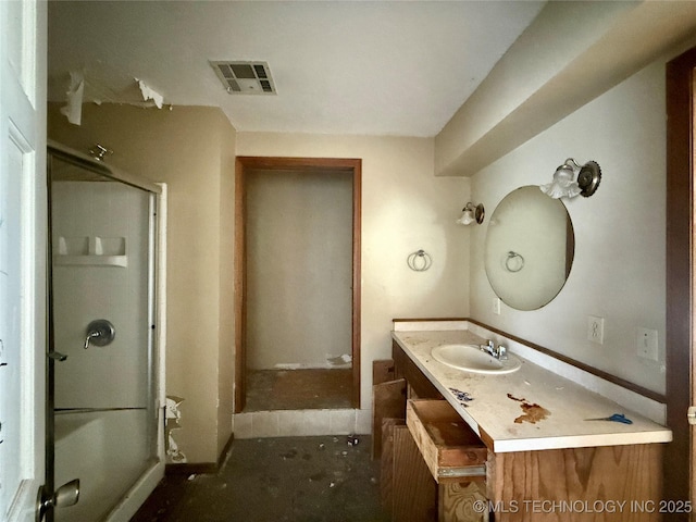 full bath with a shower stall and vanity