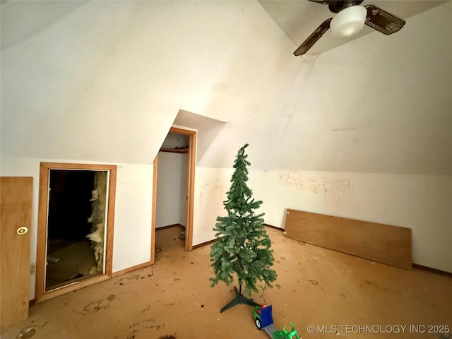 bonus room with lofted ceiling, a ceiling fan, and baseboards