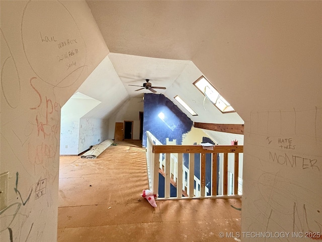 bonus room with a ceiling fan and lofted ceiling