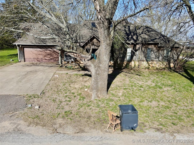 view of home's exterior featuring driveway