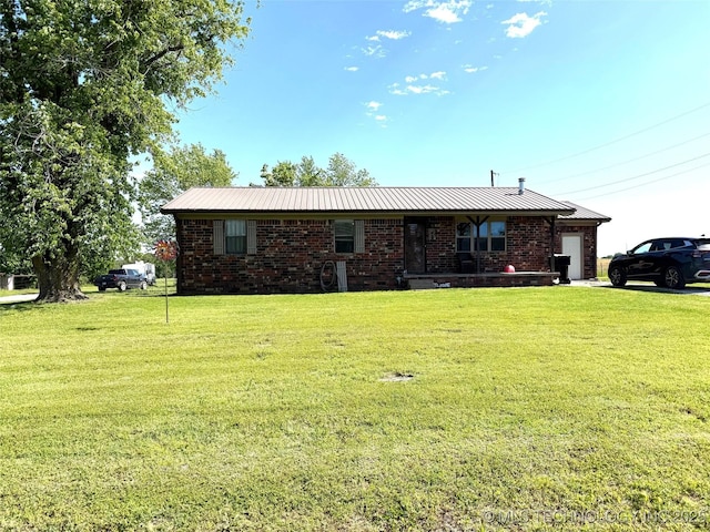 15760 Briar Rd, Morris, OK 74445 - single story home featuring a garage, a front yard, brick siding, and metal roof