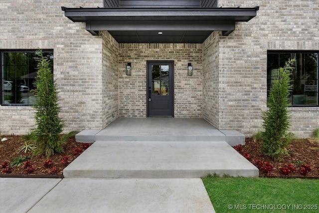 property entrance with brick siding