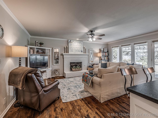 5517 E 101st Pl, Tulsa, OK 74137 - living area with a ceiling fan, ornamental molding, dark wood-style flooring, baseboards, and a brick fireplace