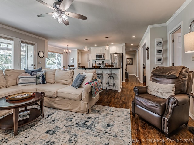 5517 E 101st Pl, Tulsa, OK 74137 - living area with a ceiling fan, ornamental molding, dark wood-type flooring, a chandelier, and recessed lighting