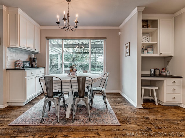 5517 E 101st Pl, Tulsa, OK 74137 - dining area with dark wood-style flooring, baseboards, ornamental molding, and a chandelier