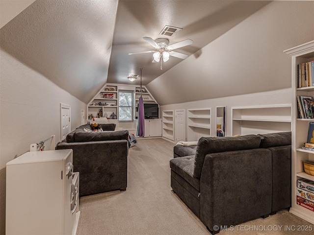 5517 E 101st Pl, Tulsa, OK 74137 - cinema room featuring built in features, light carpet, vaulted ceiling, and a ceiling fan