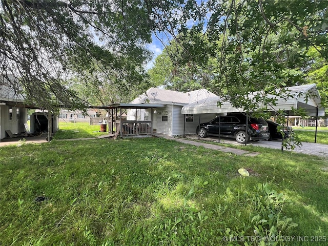 309 Albany St, Ketchum, OK 74349 - back of property featuring a yard and driveway