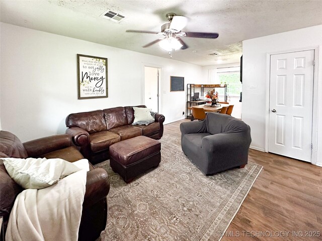 602 S Elm St, Muldrow, OK 74948 - living room featuring ceiling fan and wood finished floors