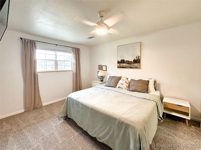 602 S Elm St, Muldrow, OK 74948 - bedroom featuring light carpet, baseboards, and a ceiling fan