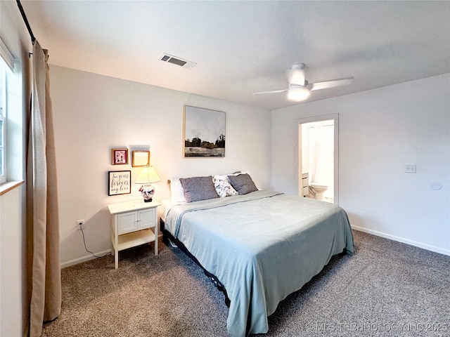 602 S Elm St, Muldrow, OK 74948 - bedroom featuring carpet, baseboards, ceiling fan, and ensuite bathroom