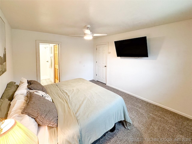 602 S Elm St, Muldrow, OK 74948 - carpeted bedroom featuring baseboards, a ceiling fan, and ensuite bath