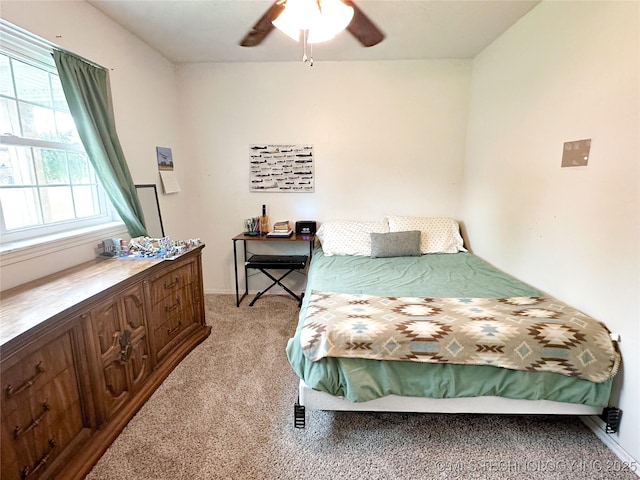 602 S Elm St, Muldrow, OK 74948 - bedroom featuring light colored carpet, baseboards, and ceiling fan